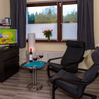 Wohn- & Schlafraum im Apartment Lohhof: Schöne Sitzecke